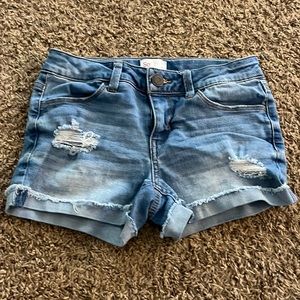blue jean shorts with small rips